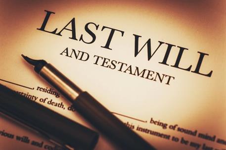 Image of a "Last Will and Testament" document with a pen resting on it, symbolizing estate planning and legal preparation.