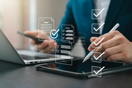 person looking at a phone and tablet with checklist overlaid over top of the person